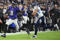 Baltimore Ravens quarterback Lamar Jackson (8) runs near Tennessee Titans linebacker Harold Landry (58) during the second half of an NFL divisional playoff football game, Saturday, Jan. 11, 2020, in Baltimore. (AP Photo/Nick Wass)