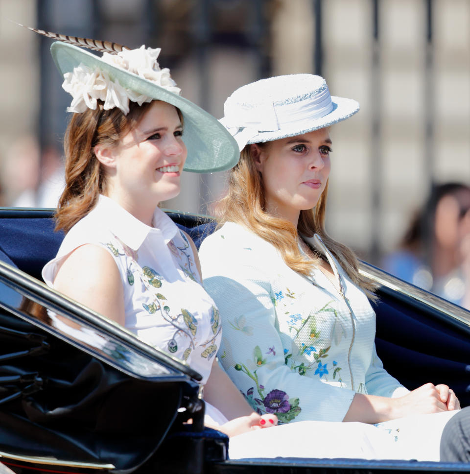 For last year’s event, sisters Beatrice and Eugenie donned co-ordinating floral looks accessorised with Philip Treacy hats. (Getty Images)