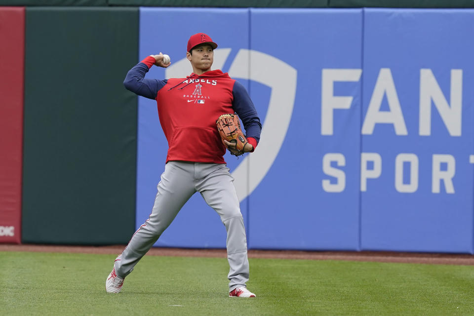 Los Angeles Angels' Shohei Ohtani throws in right field before a baseball game against the Chicago White Sox Monday, May 2, 2022, in Chicago. (AP Photo/Charles Rex Arbogast)
