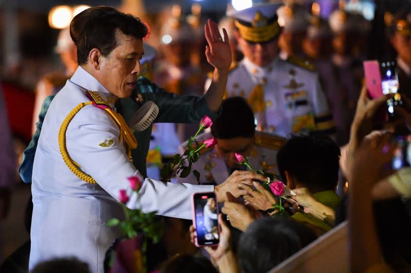 Thailand's King Maha Vajiralongkorn and Queen Suthida greet royalists during their appearance, in Bangkok