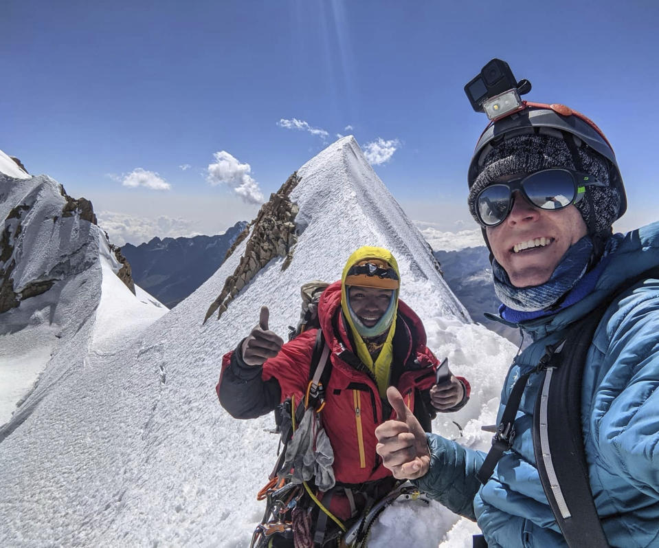 In this Aug. 22, 2021, photo released by Jean Granberg, her son Daniel Granberg, right, poses for a selfie with his guide, David, left, while climbing Huayna Potosi's French Route, or Via de Los Franceses near La Paz, Bolivia. The body of the American man, who died while climbing one of Bolivia’s highest peaks, arrived Sunday, Sept. 5 in the country’s capital after a two-day recovery effort. Rescue workers said 24-year-old Granberg, of Colorado, died atop the Illimani mountain.(Daniel Granberg/Jean Granberg family via AP)