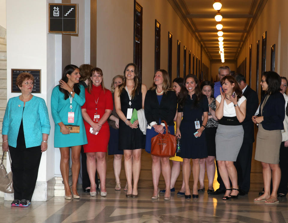 A group of Harry's fans - staff at the Capitol Building - wait for Prince Harry's arrival (PA)