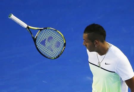 Nick Kyrgios of Australia throws his racquet after missing a return against Andy Murray of Britain during their men's singles quarter-final match at the Australian Open 2015 tennis tournament in Melbourne January 27, 2015. REUTERS/Carlos Barria