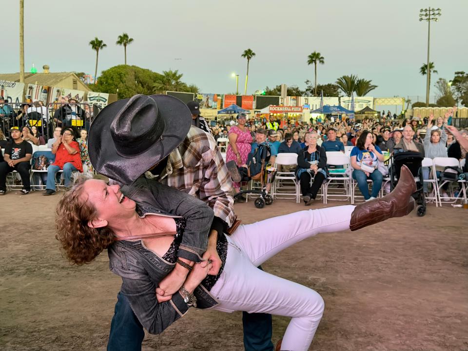 Dean Blanks of Ventura dances with his girlfriend Gabrielle White as legendary R&B singer Patti LaBelle sings at the Ventura County Fair on Thursday.