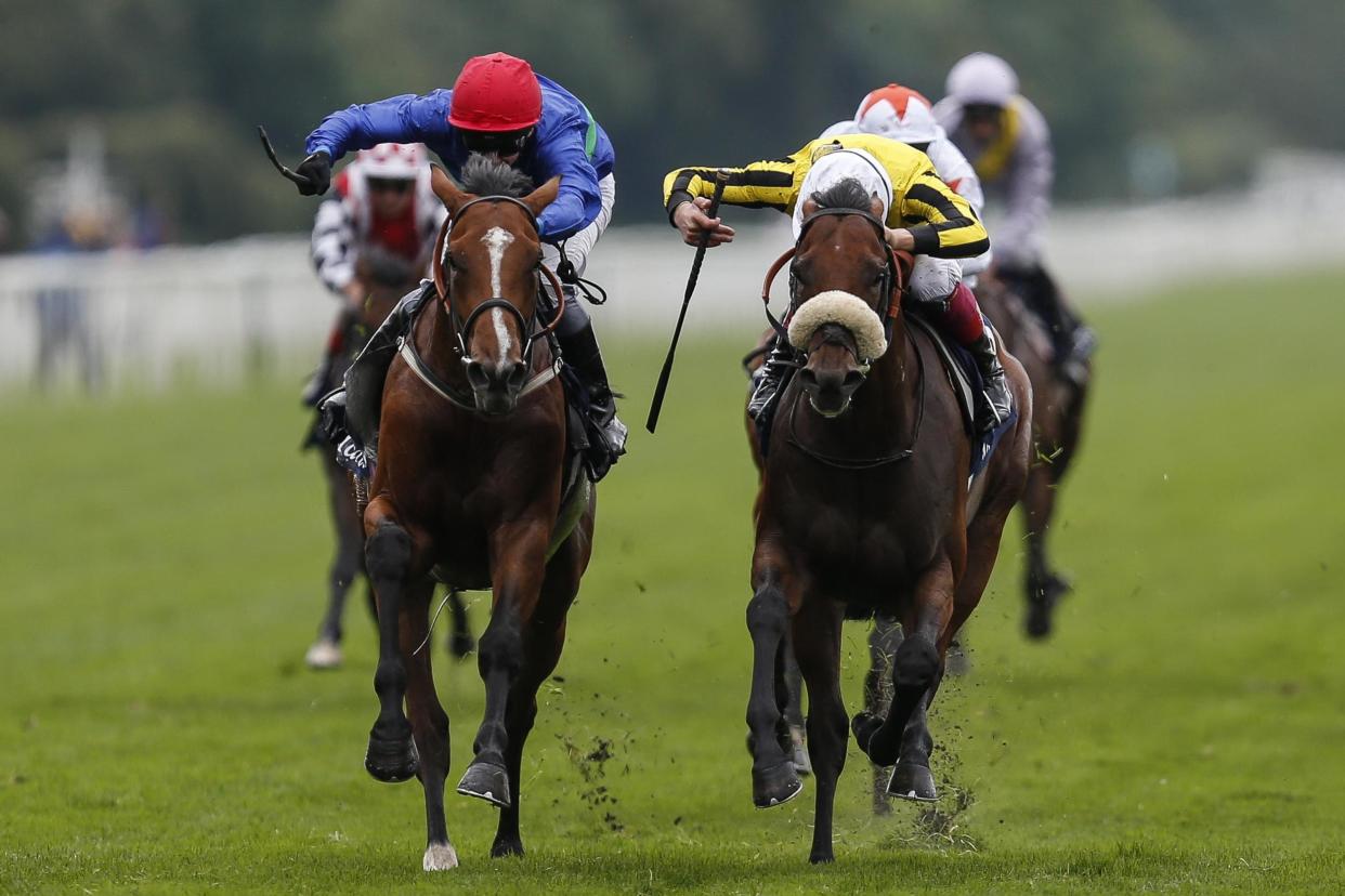 David Allan riding Wells Farhh Go (L, blue) against James Garfield (R, yellow) at York racecourse in 2017: Getty Images