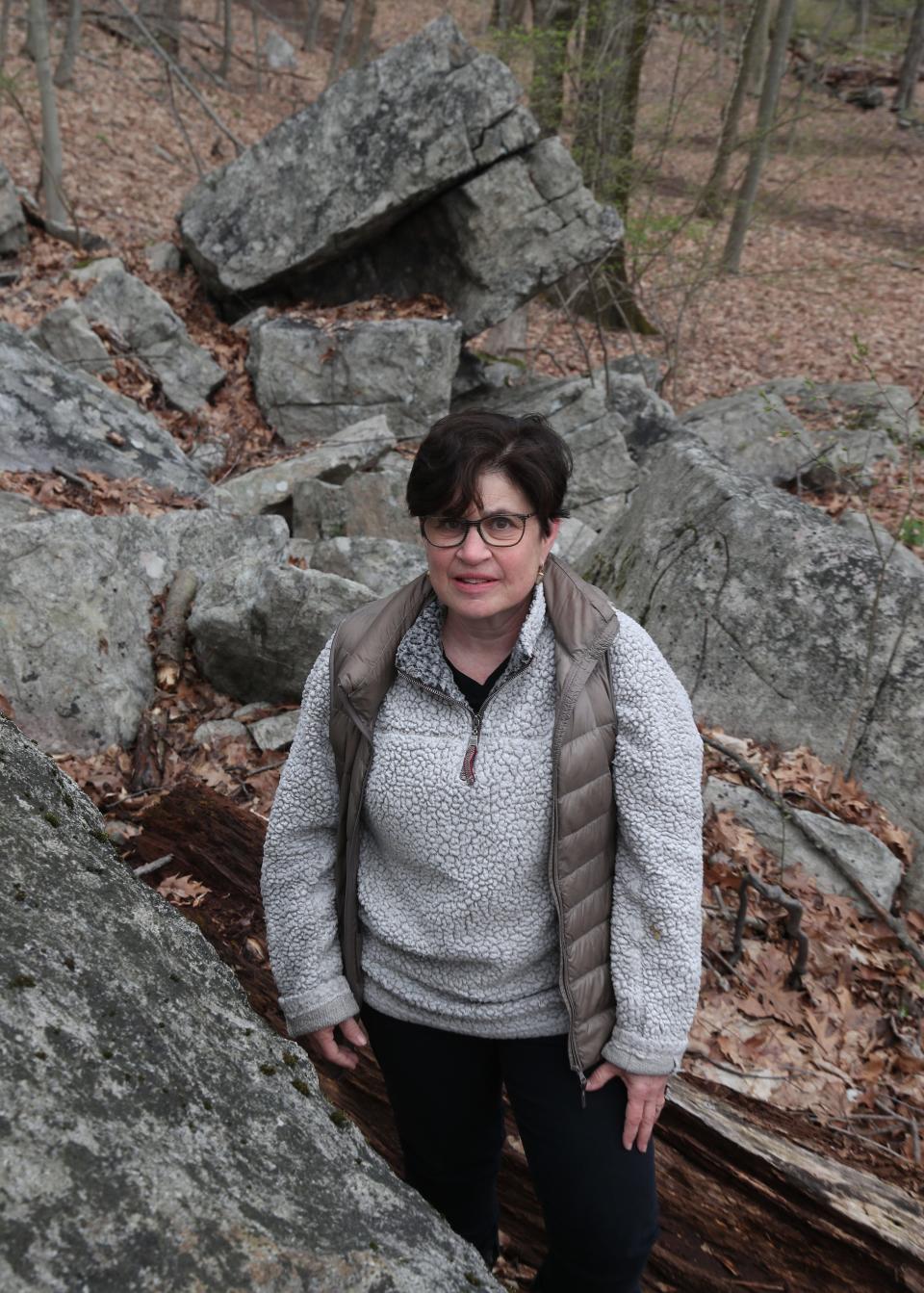 Tracey Bilski walks among the ceremonial stone landscapes on her Chappaqua property April 19, 2022. 