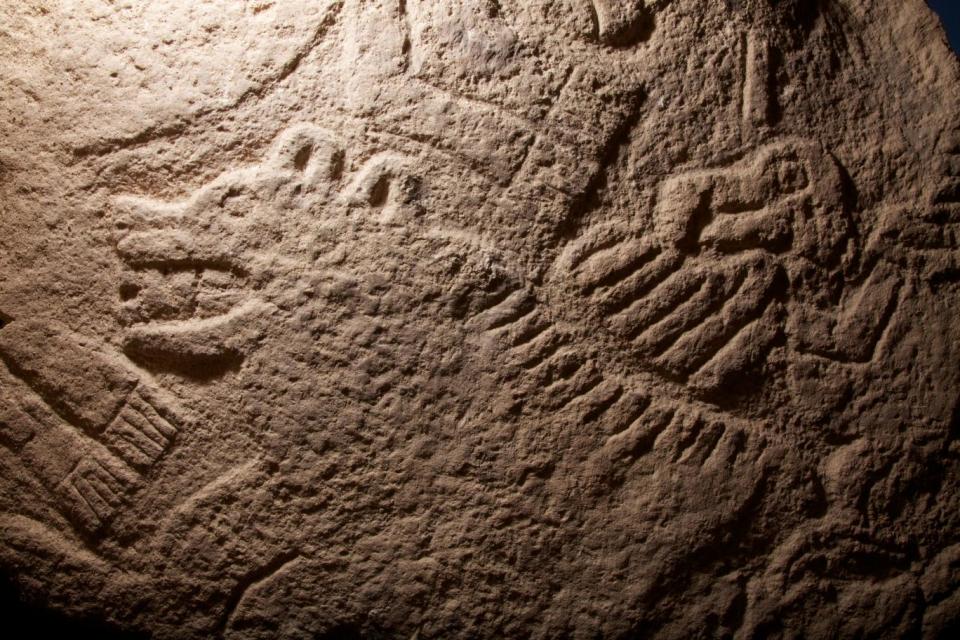 A broken pillar with a carved vulture stands at Göbekli​ Tepe (VINCENT J. MUSI/National Geographic Creative)