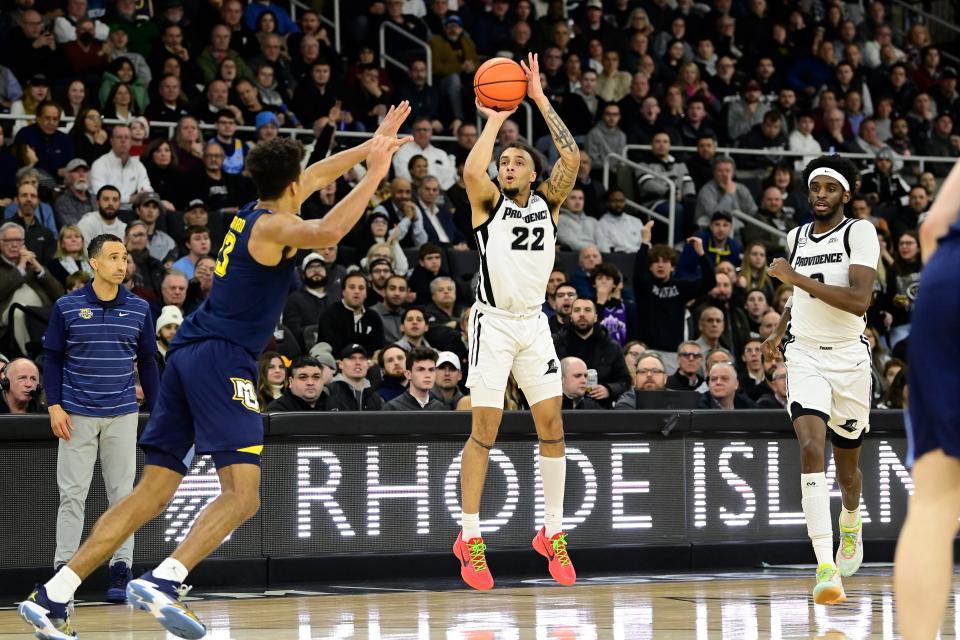 Providence guard Devin Carter (22) shoots against Marquette during Tuesday's game at Amica Mutual Pavilion.