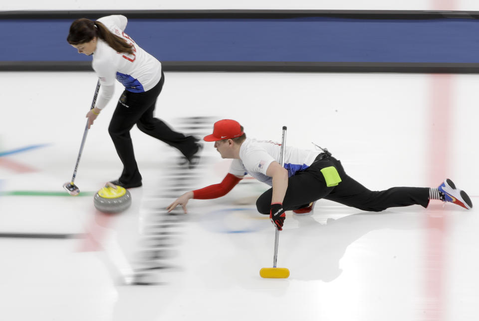 <p>United States’ Matt Hamilton throws a stone, right, as his sister and teammate Becca sweeps the ice during a mixed doubles curling match against China’s Wang Rui and Ba Dexin at the 2018 Winter Olympics in Gangneung, South Korea, Saturday, Feb. 10, 2018. (AP Photo/Natacha Pisarenko) </p>