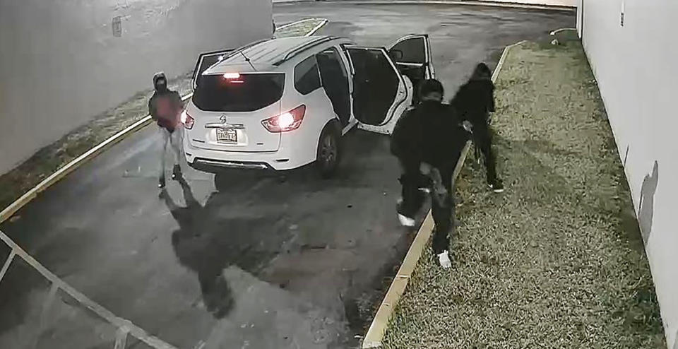 Image: Security video of three people before shooting in Miami  (Via Miami-Dade Police Department)