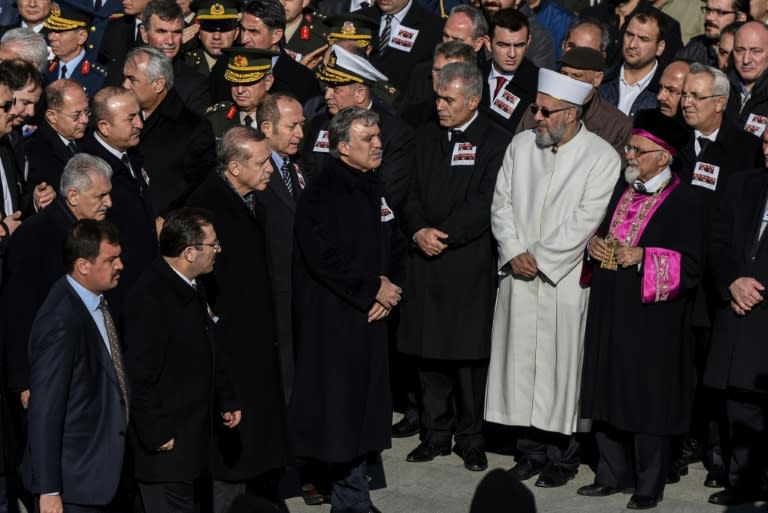 Turkish President Recep Tayyip Erdogan (3rd left) attends a funeral cerenomy at Istanbul's police headquarters on December 11, 2016