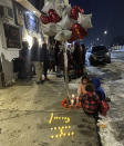 Supporters of Howard Johnson, 24, who was fatally shot by police in St. Paul, Minn., on Monday, held a vigil at the shooting scene on Tuesday night, Dec. 6, 2022. (Gabrielle Lombard/Pioneer Press via AP)