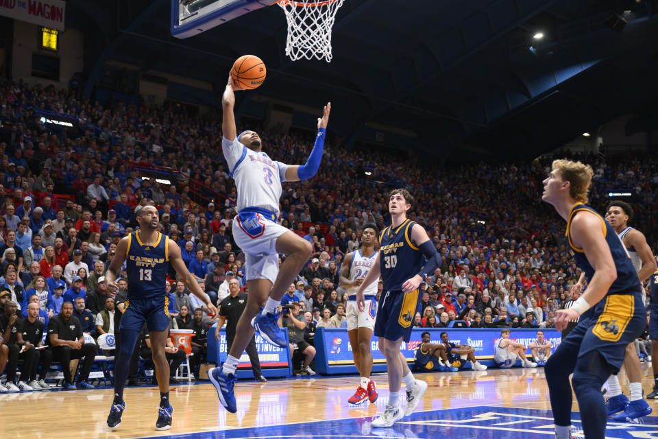 Kansas guard Dajuan Harris Jr. (3) goes up for a shot against Kansas City during the first half of an NCAA college basketball game in Lawrence, Kan., Tuesday, Dec. 5, 2023. (AP Photo/Reed Hoffmann)