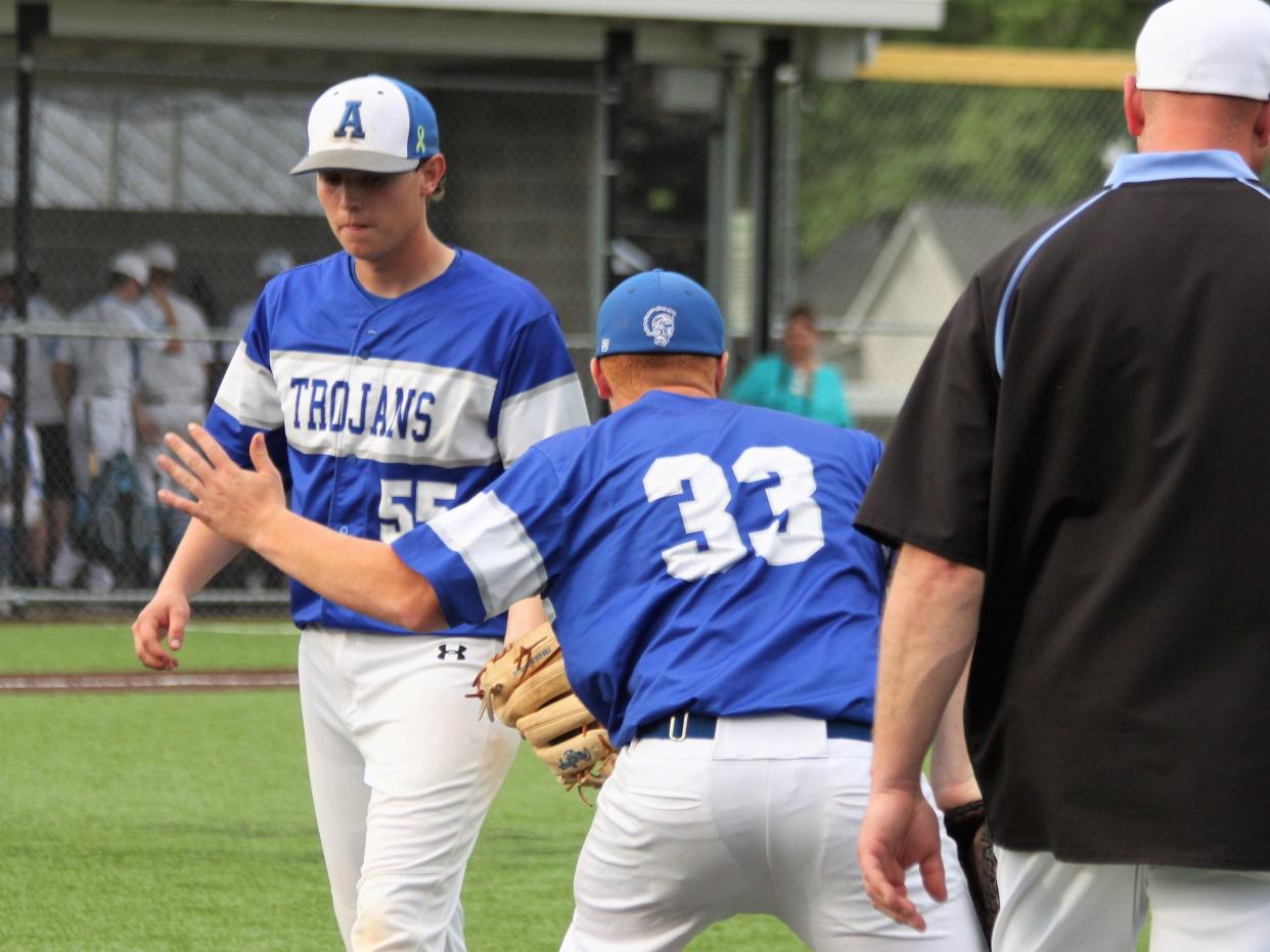 Auburn senior pitcher Luke Boesdorfer returns to the dugout during the Class 2A North Mac Regional semifinal against the host Panthers on Thursday, May 19.