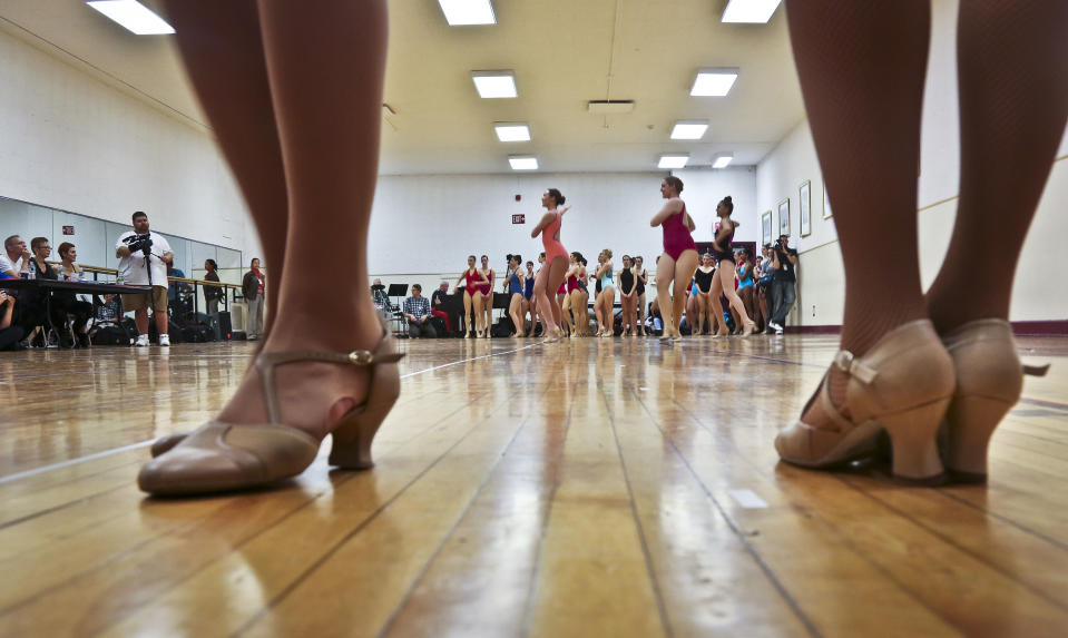 Dancers wait on the sidelines for their turn to audition to appear with The Rockettes at the 2013 Radio City Christmas Spectacular, Tuesday, April 30, 2013 in new York.  Those who make it — a good dozen or so out of hundreds of young women from around the country  — will return for the show that runs from Nov. 8 to Dec. 30.  (AP Photo/Bebeto Matthews)