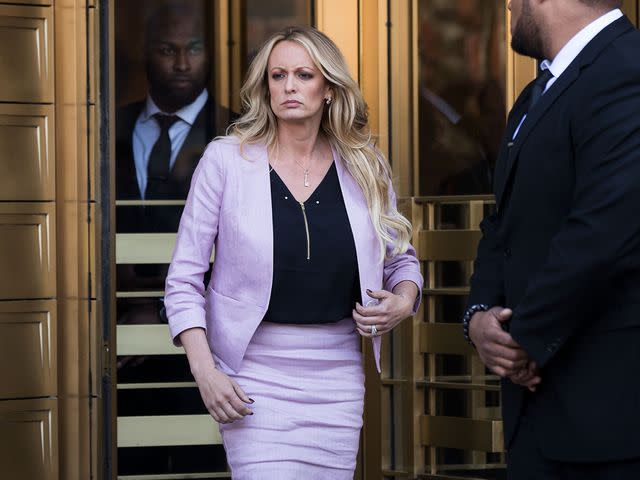 <p>Drew Angerer/Getty</p> Stormy Daniels exits the United States District Court Southern District of New York for a hearing related to Michael Cohen on April 16, 2018.