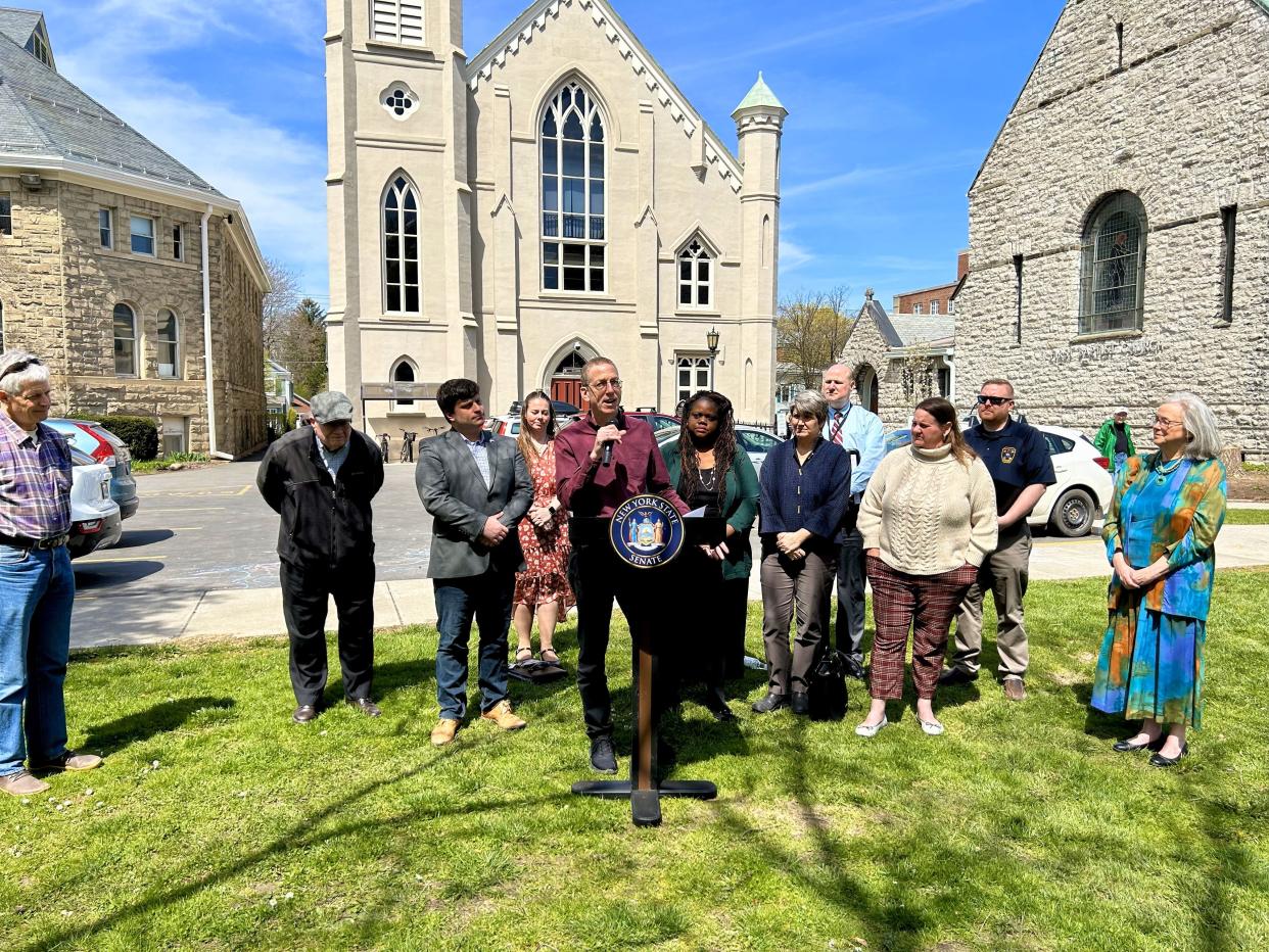 Tompkins County Legislature Chairperson Dan Klein, surrounded by Ithaca City and state officials, speaks on the county's Rapid Medical Response Program, to be funded with $300,000 from this year's NY state budget.