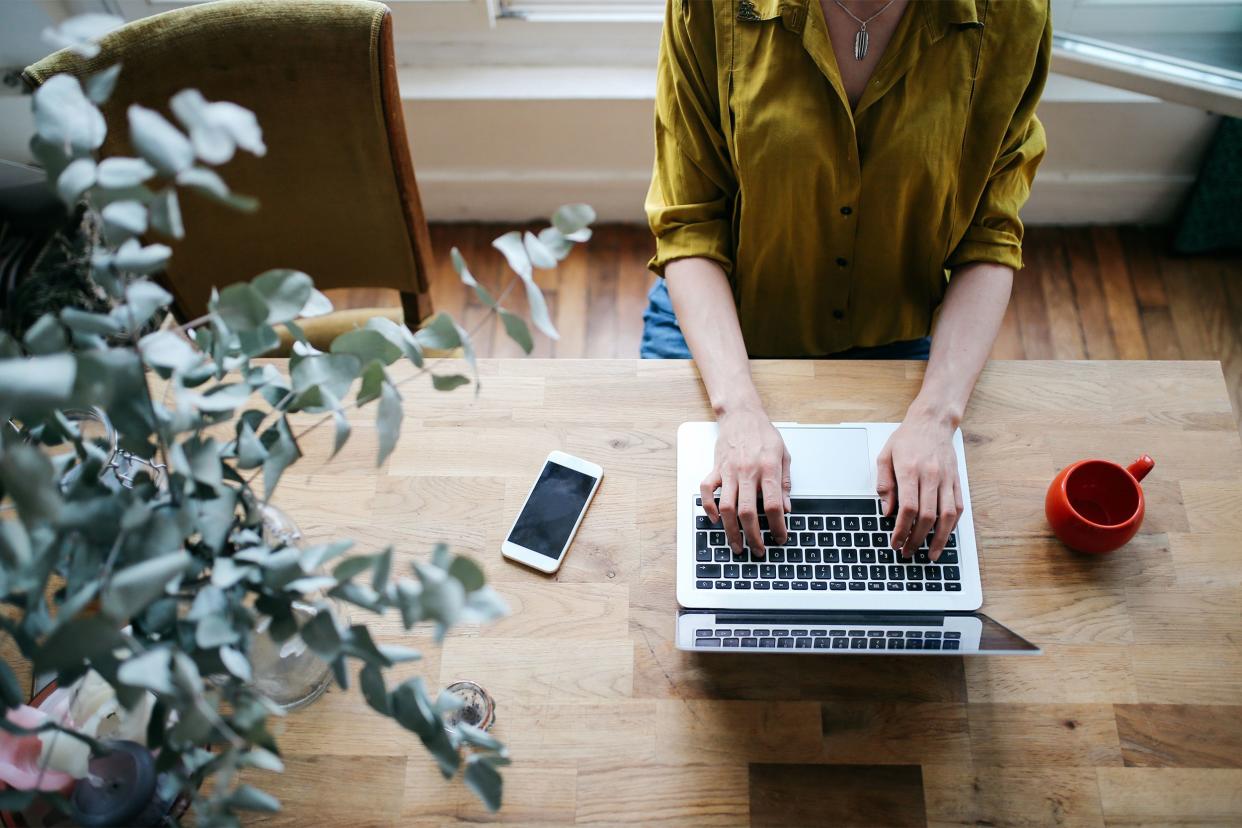 Closeup of woman on her laptop