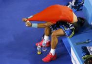 Rafael Nadal of Spain removes his shirt during his men's singles semi-final match against Roger Federer of Switzerland at the Australian Open 2014 tennis tournament in Melbourne January 24, 2014. REUTERS/David Gray