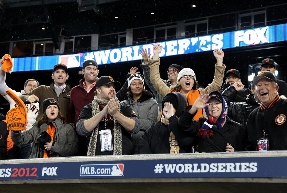 The San Francisco Giants fans cheer after defeating the Detroit Tigers in the tenth inning to win Game Four of the Major League Baseball World Series at Comerica Park on October 28, 2012 in Detroit, Michigan. The San Francisco Giants defeated the Detroit Tigers 4-3 in the tenth inning to win the World Series in 4 straight games. (Photo by Christian Petersen/Getty Images)