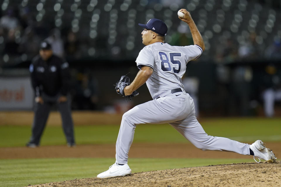 New York Yankees' Greg Weissert pitches against the Oakland Athletics during the seventh inning of a baseball game in Oakland, Calif., Thursday, Aug. 25, 2022. (AP Photo/Godofredo A. Vásquez)