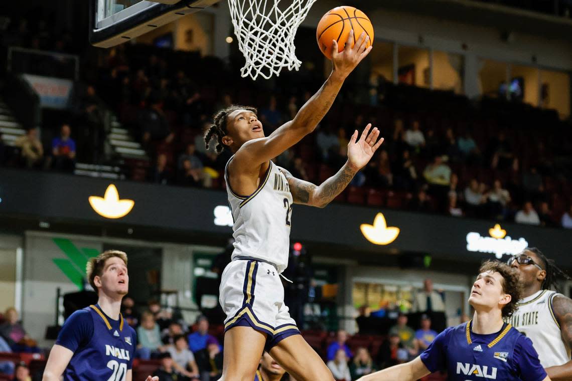 Montana State guard RaeQuan Battle (21) lays the ball up for a basket against Northern Arizona in the first half of an NCAA college basketball game for the championship of the Big Sky men’s tournament in Boise, Idaho, Wednesday, March 8, 2023. (AP Photo/Steve Conner)