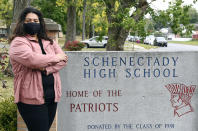 Kristina Negron poses for a photograph Tuesday, Sept. 29, 2020, in Schenectady, N.Y. Negron was laid off from her job as an aide for a special education class at Schenectady High School due to budget cuts. (AP Photo/Hans Pennink)