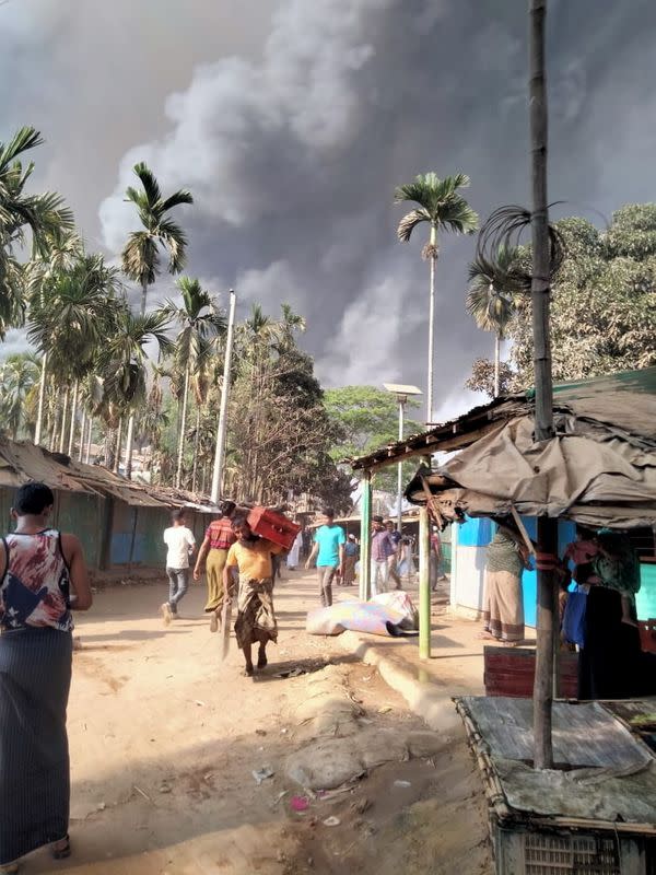 Smoke from a fire is seen at a Balukhali refugee camp in Cox's Bazar