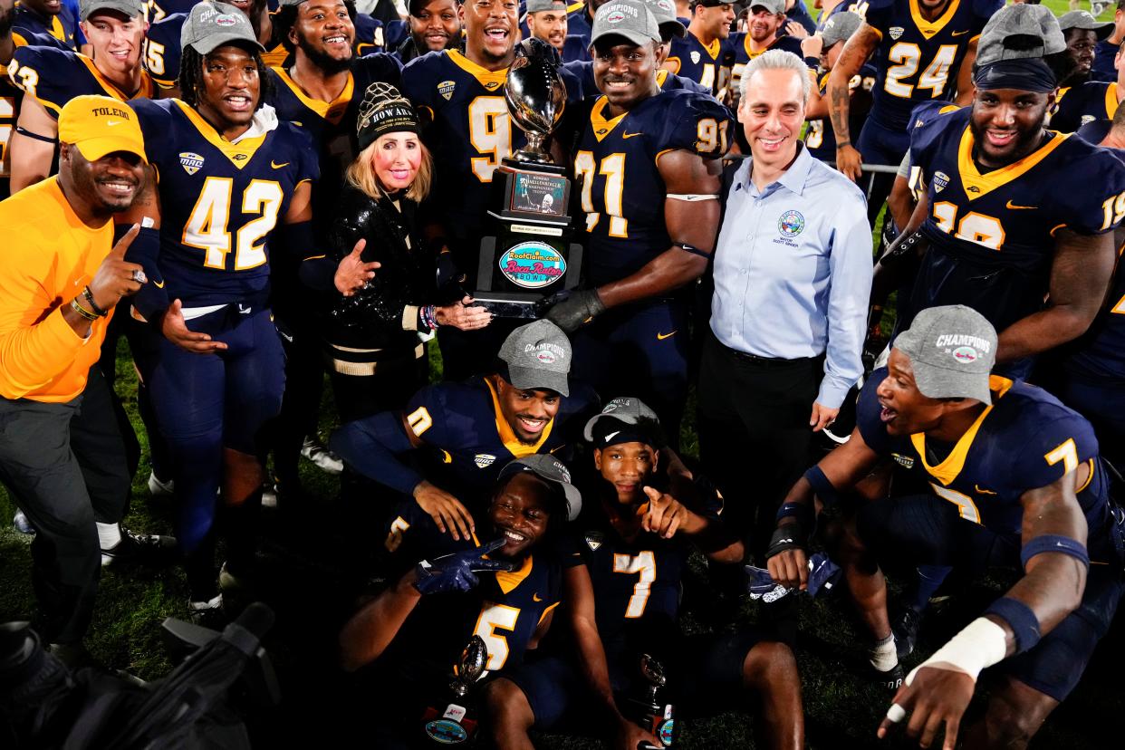 The Toledo Rockets celebrate winning the 2022 Boca Raton Bowl.