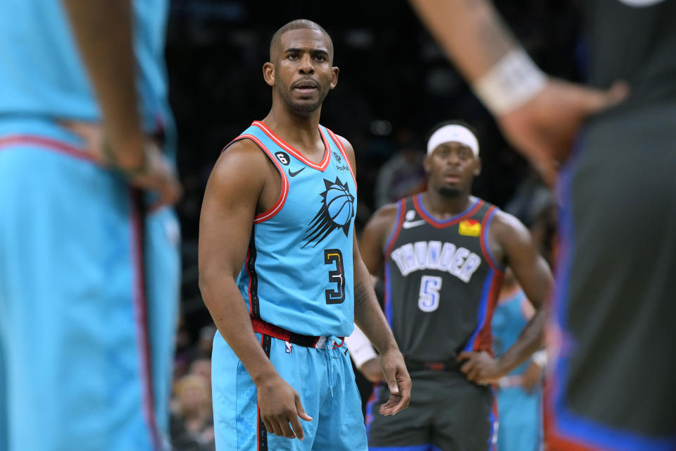 Phoenix Suns guard Chris Paul (3) stares down Oklahoma City Thunder forward Kenrich Williams during the second half of an NBA basketball game Friday, Feb. 24, 2023, in Phoenix. The Suns won 124-115. (AP Photo/Rick Scuteri)