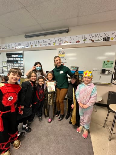 KOIN 6 anchor Emily Burris celebrates National Read Across America Day with students at John Wetten Elementary School in Gladstone on Mar. 1, 2024 (KOIN)