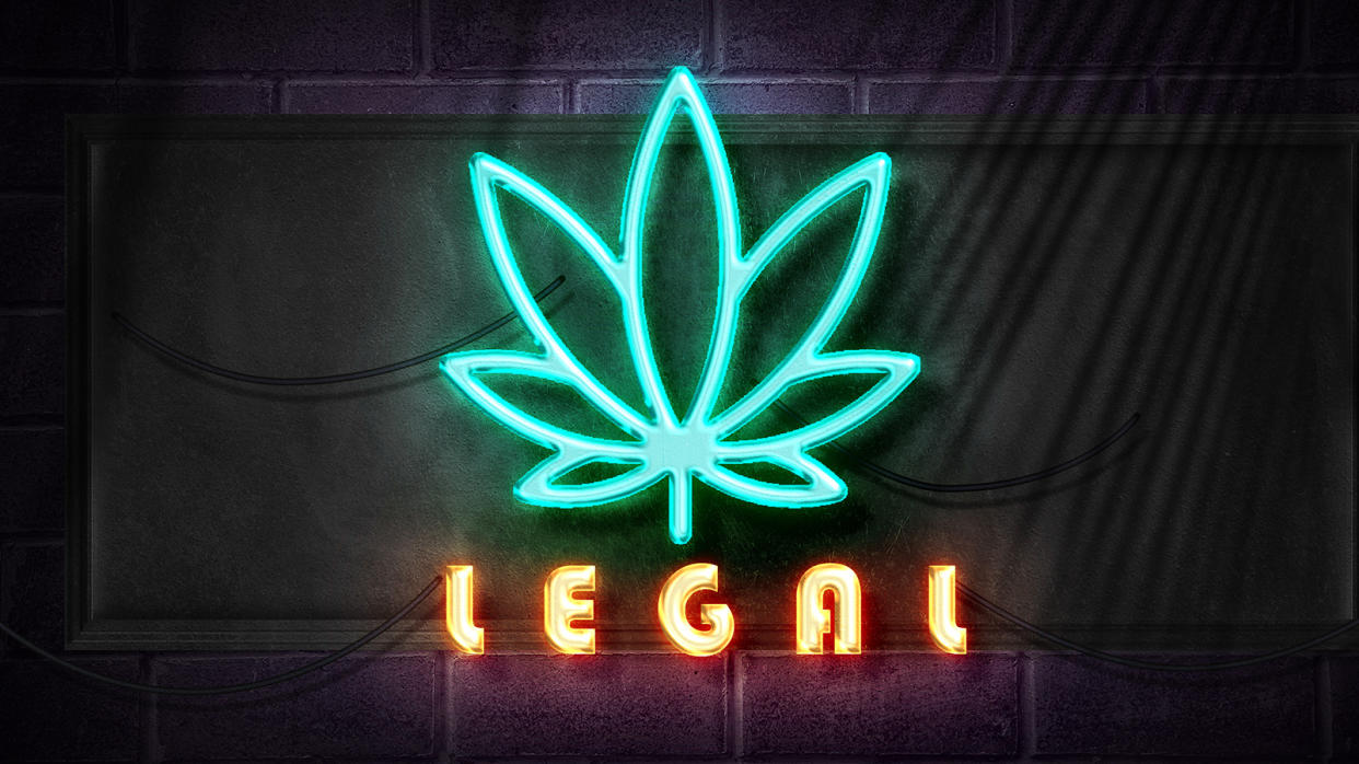 marijuana symbol  with legal text in neon lights