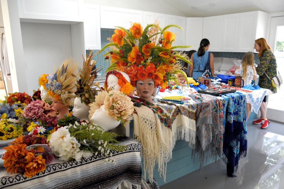 Vinok headdresses designed by Tatyana Krasilshchikov line a table of accessories for a photoshoot fundraiser for Ukraine in West Windsor Township, New Jersey on Sunday, September 4, 2022.