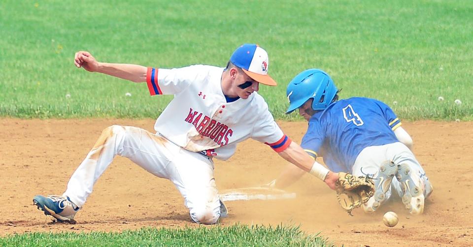 The ball gets away from Boonsboro second baseman Carter Stotelmyer as Clear Spring's Malakai Cunningham slides safely for a stolen base in the sixth inning of the Blazers' 5-0 win.