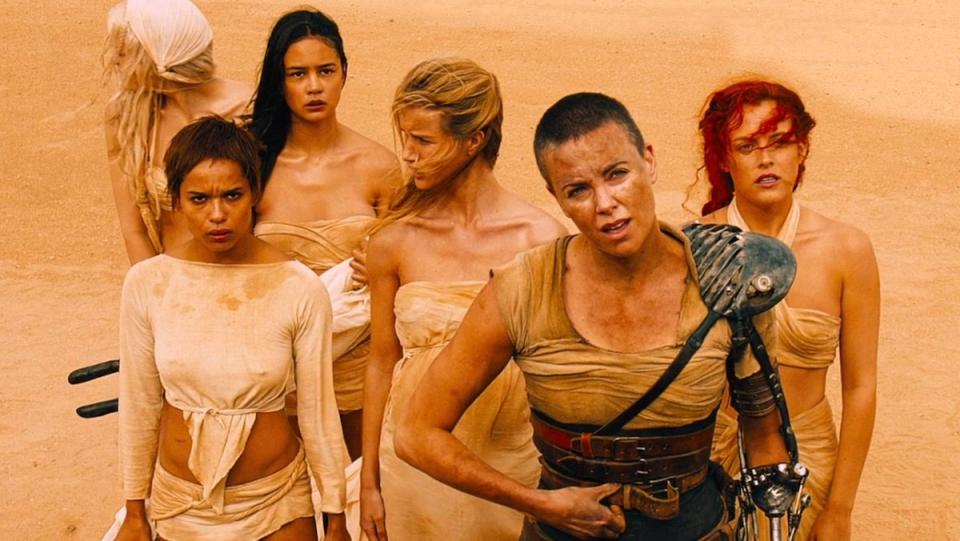 Furiosa and the Five WIves stand in the desert in ad Max: Fury Road