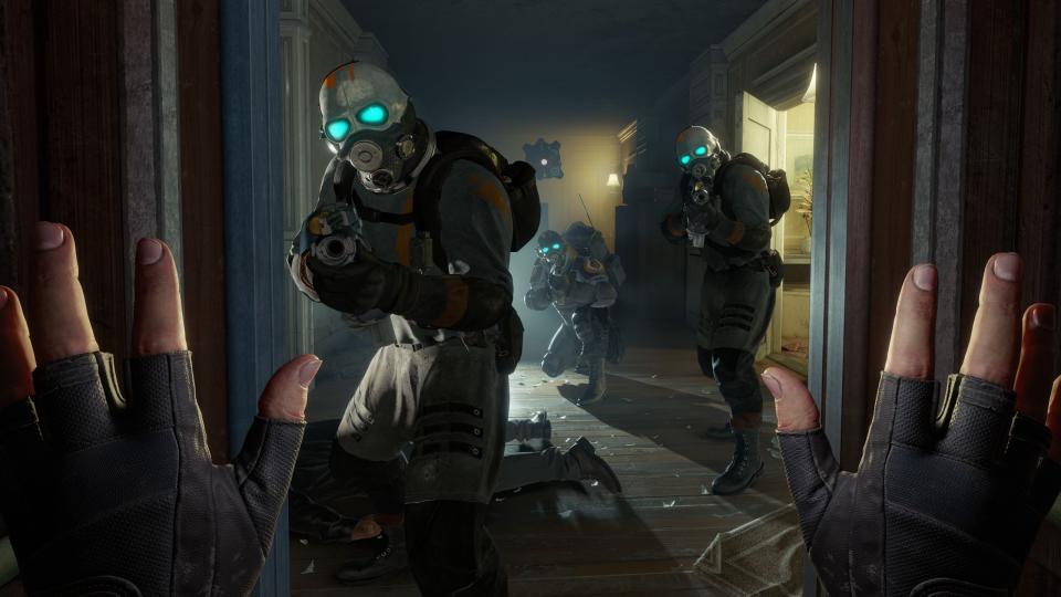 First-person look at masked enemies pointing guns and a set of hands raised in surrender.