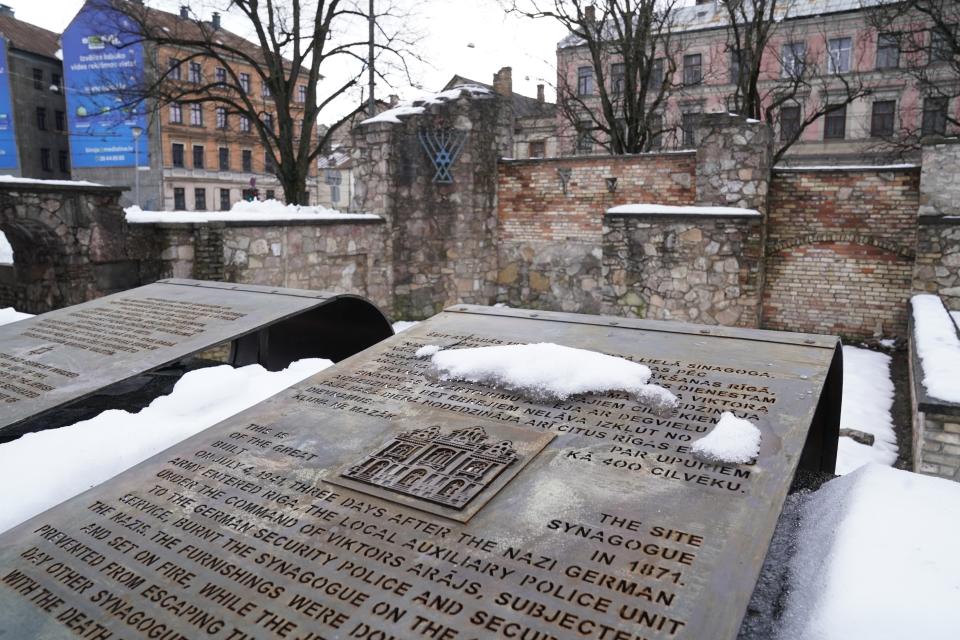 The memorial on the ruins of the Riga Choral Synagogue burned to the ground by Nazis in 1941, in memory of those who perished in the blaze, in Riga, Latvia, Thursday, Feb. 10, 2022. Latvia’s Parliament has passed a milestone Holocaust restitution bill after years of wrangling in a move that will provide compensation for lost prewar Jewish property and funding to revitalize the Baltic nation’s Jewish community that perished almost completely during World War II. (AP Photo/Roman Koksarov)