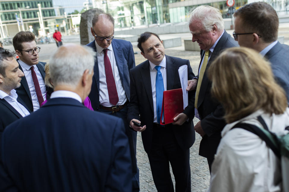 British lawmaker Alberto Costa, centre, gathers with a cross-party delegation of British parliamentarians before meeting European Union chief Brexit negotiator Michel Barnier, at the European Commission headquarters in Brussels, Friday, July 19, 2019. (AP Photo/Francisco Seco)