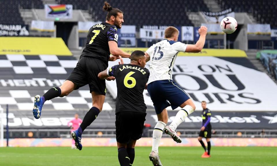 Andy Carroll heads the ball against Eric Dier’s arm to earn a penalty for Newcastle