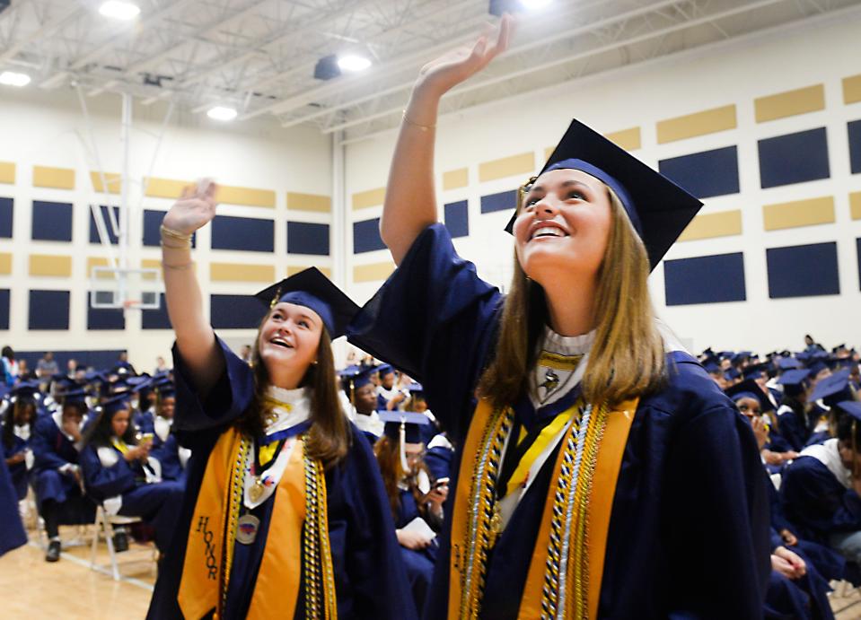 The Commencement service for Spartanburg High School's Class of 2024 was held at the high school on Saturday, May 18, 2024. Class President 2024, Anna Beeson, right, and classmates waves at the crowd before the service starts.