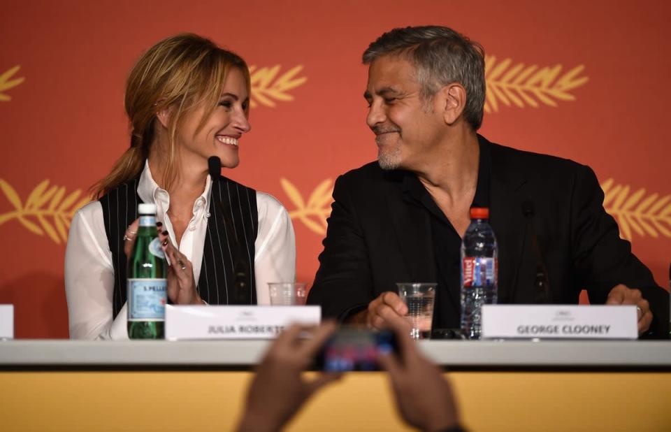 Julia Roberts and George Clooney speaking at the Money Monster press conference in 2016 (Getty Images)