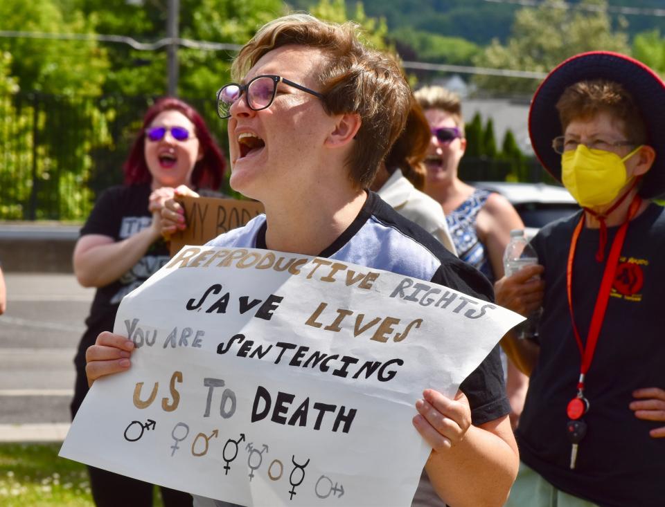 Binghamton resident Emily Blakley chants in support of abortion rights at a demonstration Monday, June 27, in front of the Family Planning of South Central New York clinic on Hawley Street in Binghamton.