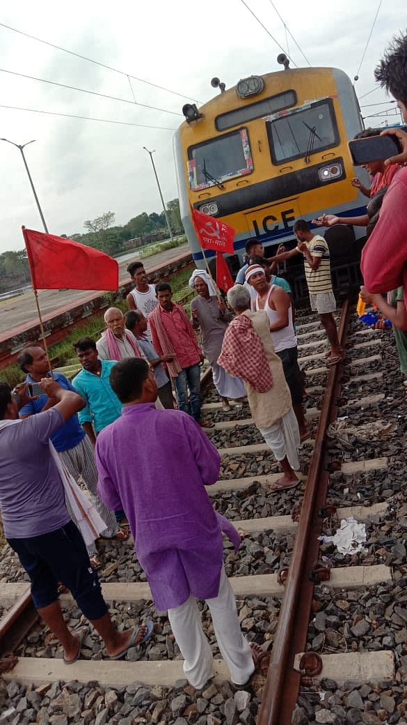 <div class="paragraphs"><p>Protestors sit on a railway track in Bihar's Vaishali.</p></div>