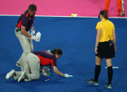 LONDON, ENGLAND - AUGUST 10: Event staff tend to the field as the Netherlands take on Argentina during the Women's Hockey gold medal match on Day 14 of the London 2012 Olympic Games at Hockey Centre on August 10, 2012 in London, England. (Photo by Daniel Berehulak/Getty Images)