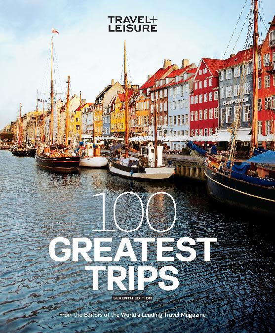 This image provided by Travel + Leisure shows the cover of the new edition of “100 Greatest Trips.” The book offers a collection of stories from Travel + Leisure magazine and its international editions about memorable destinations around the world, from exotic locales like Tasmania and Zanzibar to U.S. itineraries in Florida and Texas. It’s one of a number of recent travel books designed to inspire and inform. (AP Photo/Travel + Leisure)