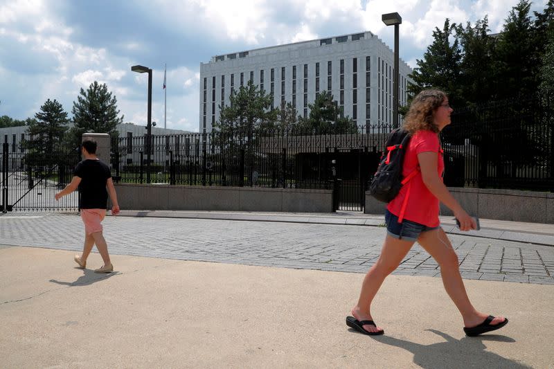 FILE PHOTO: Pedestrians pass the Embassy of Russia in Washington