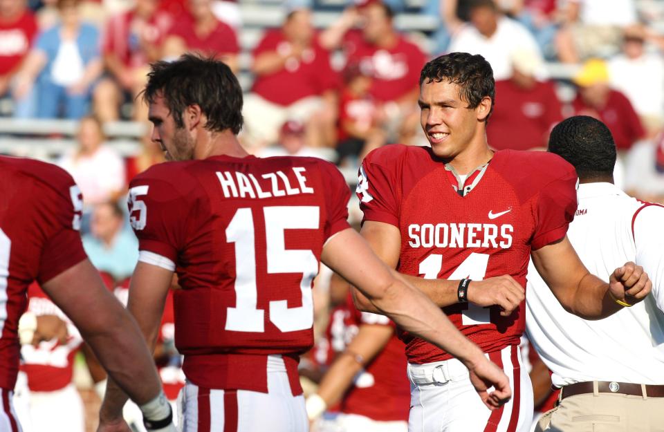 Oklahoma Sooners quarterback Sam Bradford (14) stretches pregame against the Texas Christian Horned Frogs at Gaylord Family Oklahoma Memorial Stadium in 2008.