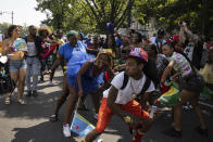 Participants dance during the West Indian Day Parade, Monday, Sep. 5, 2022, in the Brooklyn borough of New York. (AP Photo/Yuki Iwamura)