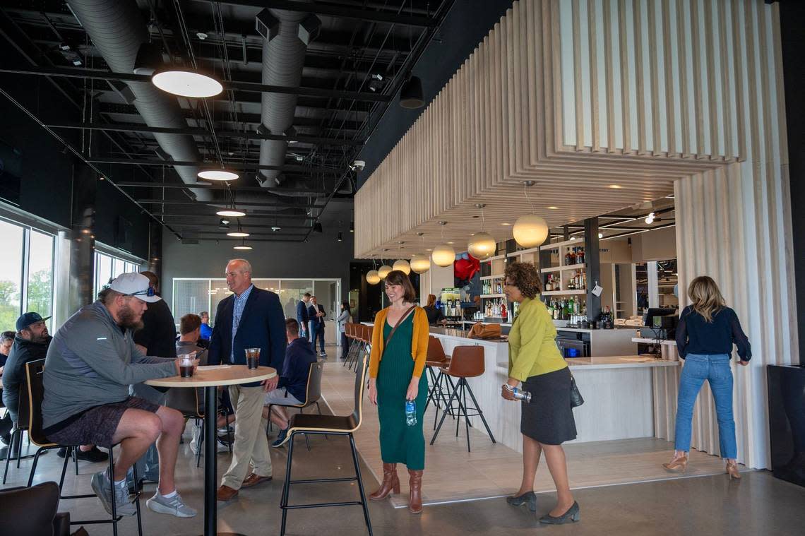 Guests tour the members’ lounge at Homefield Kansas City.