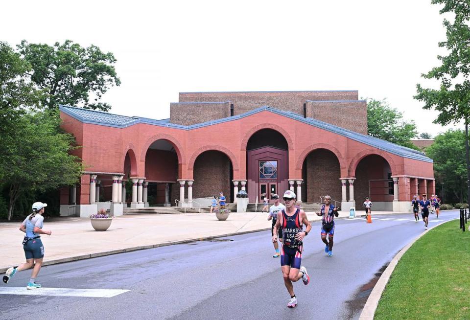 Participants in the Ironman 70.3 Pennsylvania Happy Valley run past the Palmer Art Museum on the Penn State campus Sunday, July 2, 2023. Steve Manuel/For the CDT